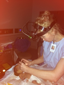 Dr Catt examining the eyes of a premature baby